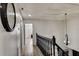 Upper hallway with dark wood railing and chandelier at 2540 Albany Dr, Kissimmee, FL 34758