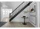 Elegant staircase with black railings and contemporary decor at 2540 Albany Dr, Kissimmee, FL 34758