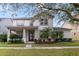 Two-story house with a landscaped lawn and front porch at 2556 Antlia Dr, Orlando, FL 32828