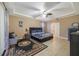 Bright main bedroom with a ceiling fan and ensuite bathroom at 2556 Antlia Dr, Orlando, FL 32828