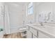 Bathroom with white vanity, tub, and shower, and wood-look tile floor at 2639 Calistoga Ave, Kissimmee, FL 34741