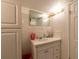 Bathroom with vanity, mirror, and storage at 26608 Bermuda Dr, Tavares, FL 32778