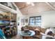 Relaxing living room with built-in shelving and large windows at 2675 Van Arsdale St, Oviedo, FL 32765