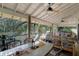 Screened porch with seating area and ceiling fan at 2675 Van Arsdale St, Oviedo, FL 32765