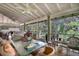 Screened porch with dining table and wooded view at 2675 Van Arsdale St, Oviedo, FL 32765