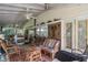 Relaxing screened porch with wicker furniture and ceiling fan at 2675 Van Arsdale St, Oviedo, FL 32765