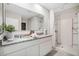 Double vanity bathroom with granite countertops and shower at 2798 Portadown St, Ormond Beach, FL 32174