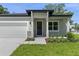 Craftsman style home with a modern door and stone accents at 2920 Lingo Ln, Orlando, FL 32822