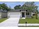 Newly built home with a modern facade and a two-car garage at 2920 Lingo Ln, Orlando, FL 32822