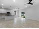 Open concept kitchen with island, stainless steel appliances, and tile floors at 2920 Lingo Ln, Orlando, FL 32822