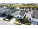 An aerial view captures the home's facade, showcasing its well-manicured lawn and tree lined street at 2950 Timber Hawk Cir, Ocoee, FL 34761