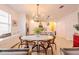 Bright dining area featuring modern chandelier, stylish decor, and open access to the kitchen at 2950 Timber Hawk Cir, Ocoee, FL 34761