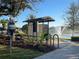 Well-kept community dog waste station with convenient waste bag dispenser near mailbox area with lovely fountain water view at 2950 Timber Hawk Cir, Ocoee, FL 34761