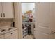 Well-organized walk-in pantry featuring wire shelving, baskets, and ample storage space at 2950 Timber Hawk Cir, Ocoee, FL 34761