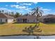 House's backyard, overlooking a lake with palm trees at 2984 Cedar Glen Pl, Oviedo, FL 32765