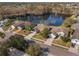 Aerial view of homes surrounding a lake, showcasing a desirable community at 2984 Cedar Glen Pl, Oviedo, FL 32765