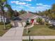 Single-Gathering home with red door and two-car garage at 2984 Cedar Glen Pl, Oviedo, FL 32765