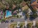 Community pool and playground are seen in this aerial view at 2984 Cedar Glen Pl, Oviedo, FL 32765