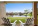 Two chairs overlooking a pond with fountain at 2984 Cedar Glen Pl, Oviedo, FL 32765