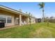 Backyard features a patio, lawn, and pond view at 2984 Cedar Glen Pl, Oviedo, FL 32765