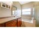 Bathroom features granite vanity, soaking tub, and walk-in shower at 2984 Cedar Glen Pl, Oviedo, FL 32765