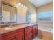 Double sink bathroom with granite countertop and bathtub at 2984 Cedar Glen Pl, Oviedo, FL 32765