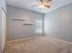 Bright bedroom featuring wall shelves and ceiling fan at 2984 Cedar Glen Pl, Oviedo, FL 32765