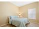 Bedroom with a light teal bedspread and window blinds at 2984 Cedar Glen Pl, Oviedo, FL 32765