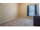 Well-lit bedroom with a window and dark dresser at 2984 Cedar Glen Pl, Oviedo, FL 32765