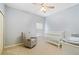 Bright Bedroom with crib, chair, and changing table at 2984 Cedar Glen Pl, Oviedo, FL 32765