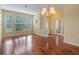 Spacious dining room with hardwood floors and a chandelier at 2984 Cedar Glen Pl, Oviedo, FL 32765