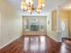 Bright dining room with hardwood floors and a chandelier at 2984 Cedar Glen Pl, Oviedo, FL 32765