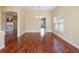 Dining room with hardwood floors and views into the living room and kitchen at 2984 Cedar Glen Pl, Oviedo, FL 32765