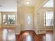 Bright entryway with hardwood floors, featuring a decorative door and French doors at 2984 Cedar Glen Pl, Oviedo, FL 32765