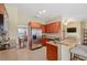 Kitchen with stainless steel appliances, granite countertops, and wood cabinets at 2984 Cedar Glen Pl, Oviedo, FL 32765