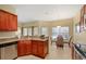 Kitchen with granite countertops and wooden cabinets at 2984 Cedar Glen Pl, Oviedo, FL 32765