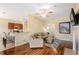 Open concept living room with kitchen views and hardwood floors at 2984 Cedar Glen Pl, Oviedo, FL 32765