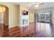 Living room with fireplace, hardwood floors and sliding doors to a lake view at 2984 Cedar Glen Pl, Oviedo, FL 32765