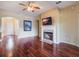 Living room with hardwood floors, fireplace and views to entryway at 2984 Cedar Glen Pl, Oviedo, FL 32765