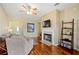 Living room boasts hardwood floors, a fireplace, and ample natural light at 2984 Cedar Glen Pl, Oviedo, FL 32765