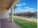 Covered patio overlooking a serene lake view at 2984 Cedar Glen Pl, Oviedo, FL 32765