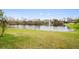 Pond view with fountain and lush landscaping at 2984 Cedar Glen Pl, Oviedo, FL 32765