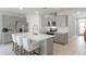 Modern kitchen with gray cabinets, quartz countertops, and an island at 2986 Salisbury Ave, Haines City, FL 33844