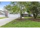 Two-car garage and neatly landscaped front yard at 3315 Newbliss Cir, Ormond Beach, FL 32174