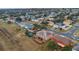 Aerial view of neighborhood with various houses at 3433 Glossy Leaf Ln, Clermont, FL 34711