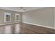 Bright bedroom with hardwood floors and neutral walls at 3433 Glossy Leaf Ln, Clermont, FL 34711