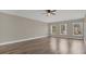 Bright bedroom with hardwood floors and three windows at 3433 Glossy Leaf Ln, Clermont, FL 34711