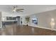 Spacious living room with hardwood floors and kitchen view at 3433 Glossy Leaf Ln, Clermont, FL 34711