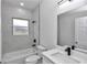 Modern bathroom with soaking tub, quartz vanity, and sleek fixtures at 3999 Sw 129Th St, Ocala, FL 34473