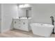 Bathroom boasts a soaking tub and double vanity at 3999 Sw 129Th St, Ocala, FL 34473